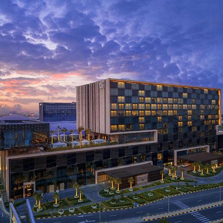Hotel Waldorf Astoria Kuwait Kuwait City Exterior foto The hotel at sunset